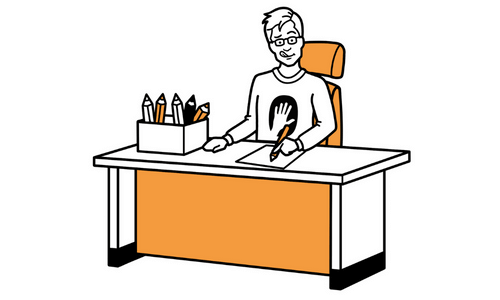 Illustrator sitting at desk drawing.