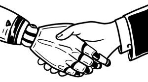 A human and a robot hand shaking each other