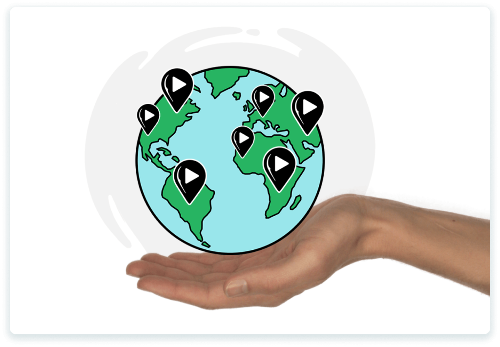 A hand holding a globe with multiple location pins